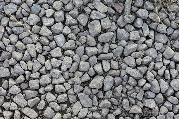 Close up high resolution image of grey stones forming a textured background ideal for design projects