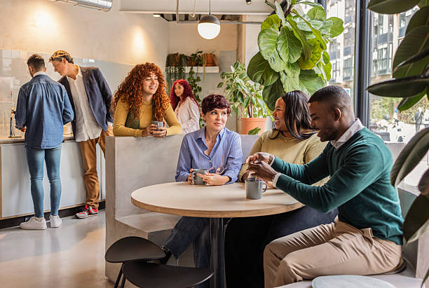 istock Diverse business team enjoying coffee break in modern office 2219295574
