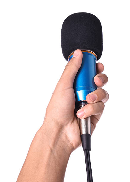 istock Man with microphone isolated on white, closeup 2219295637