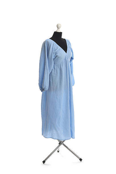 istock Female mannequin with light blue dress isolated on white 2219295672