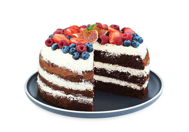 istock Cut delicious chocolate sponge cake with berries isolated on white 2219296617