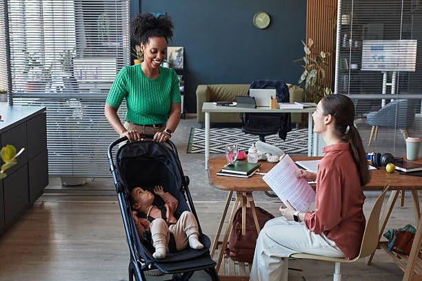 istock Meeting in Office with Mother and Baby Stroller Present 2219296726