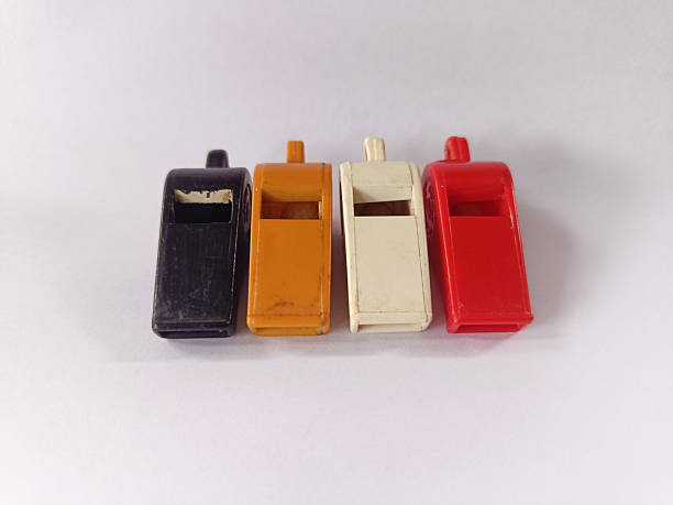 istock Four plastic whistles in various colors, usually used for various activities. 2219298082