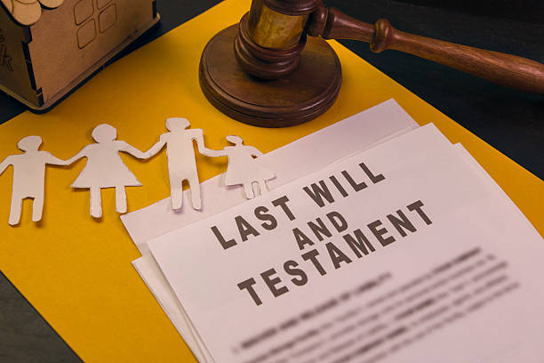 istock Will and testament with family paper figures and gavel 2219300171