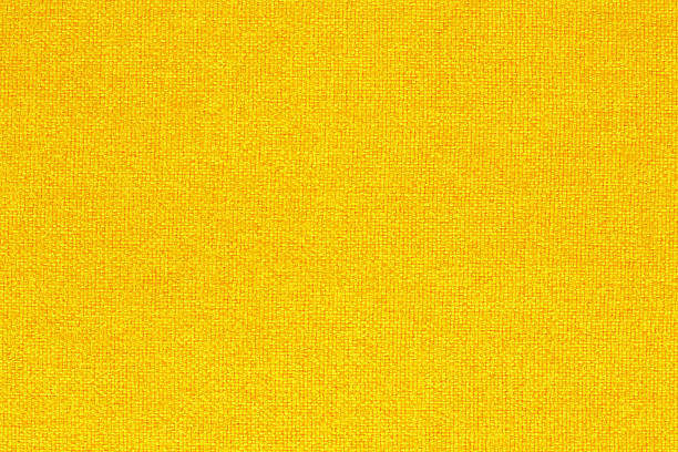 istock Yellow golden fabric cloth texture background, seamless pattern of natural textile. 2219300220