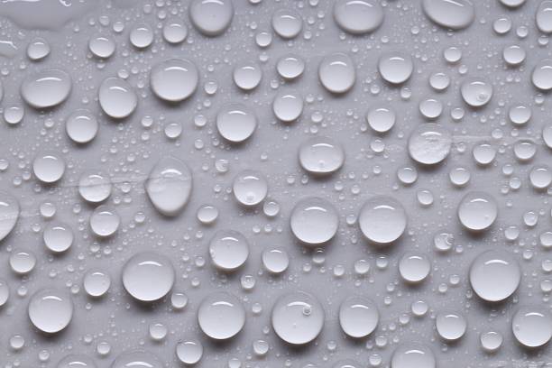 istock Water drops on gray background, top view 2219300579