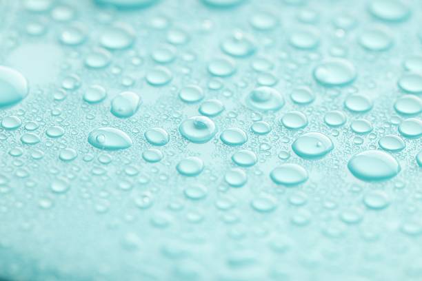 istock Water drops on turquoise background, closeup view 2219300603
