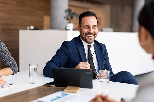 istock Business Professional Smiling in Office Meeting and Discussion Setting 2219300619