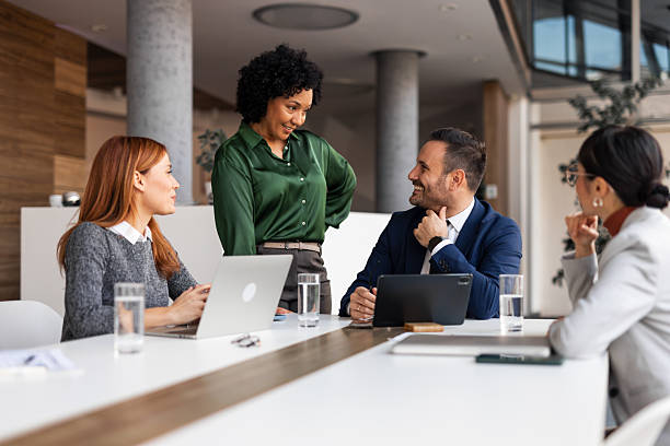 istock Team Discussing Project Ideas During a Collaborative Office Meeting Session 2219300640