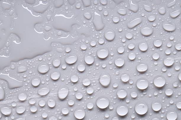 istock Water drops on gray background, top view 2219300666