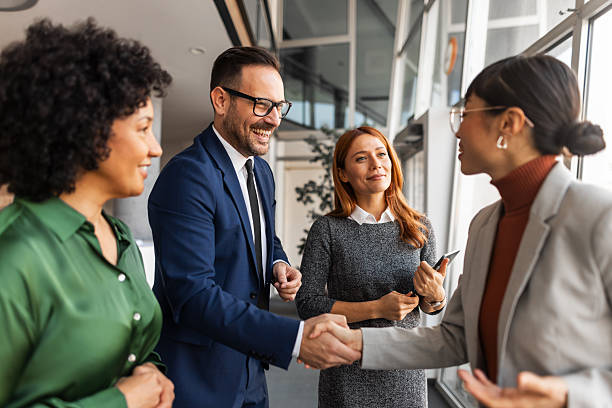 istock Professional Colleagues Shaking Hands During a Meeting in a Modern Office 2219300741