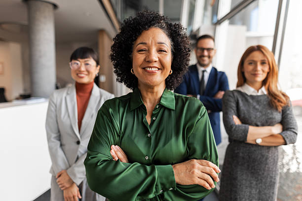 istock Confident Diverse Business Team Smiling in Modern Corporate Office Setting 2219300776
