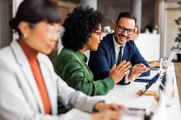 istock Professional Team Engaged in a Collaborative Office Meeting Environment 2219300792