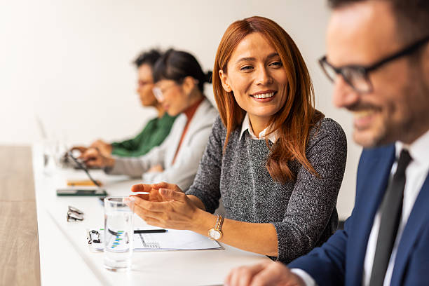 istock Smiling Business Professionals Collaborating in a Modern Office Setting 2219300857