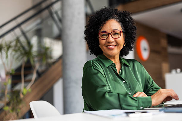 istock Confident Professional Woman Smiling in Modern Office Setting 2219301523