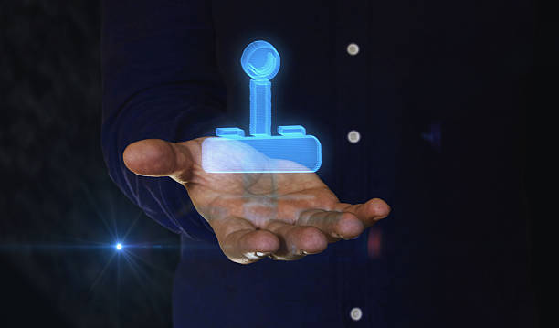 istock Joystick gaming symbol over hand 2219302667