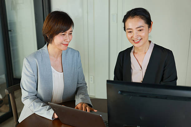 istock Asian Female agent talking to her customer at office 2219303571