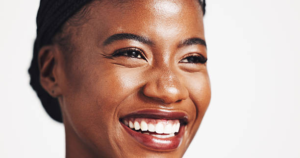 istock Space, thinking or happy black woman with makeup for beauty, cosmetics or acne solution on white background. Studio, cosmetology or African model with ideas for foundation, skincare or glowing shine 2219303887