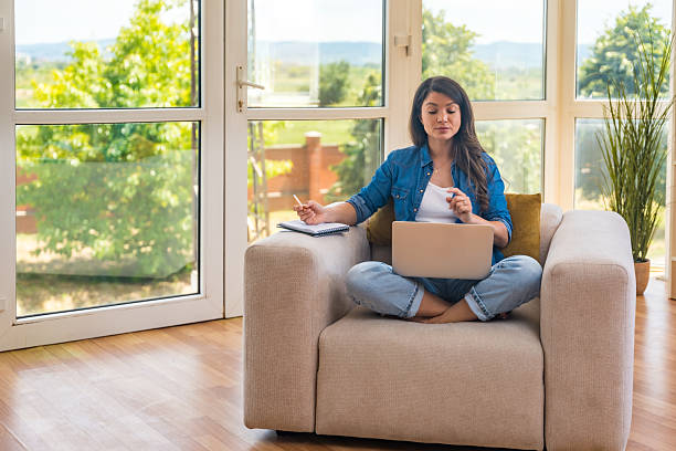 istock Young home-based online therapist in virtual counseling session, focused mental health professional listening to client on video call taking notes offering support and empathy in calm domestic setting 2219304049