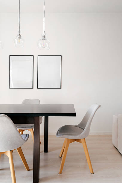 istock Minimalist dining area with sleek furniture and natural light 2219304521