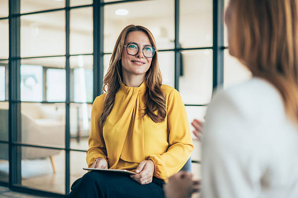istock Two business coworkers talking 2219308132