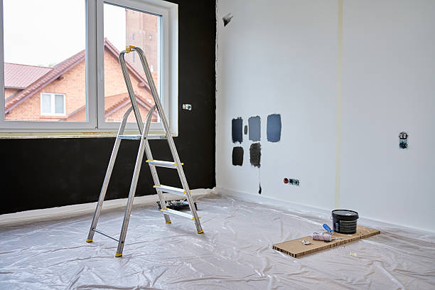 istock Interior room during renovation with ladder, paint samples and painting tools 2219308474