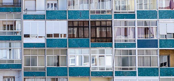 istock Windows of a multi-apartment residential building. 2219308506