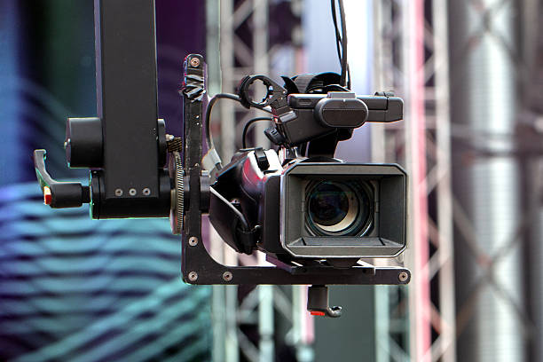 istock Professional video camera on a crane during an outdoor event. 2219309575