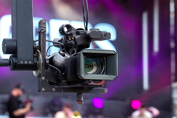 istock Professional video camera on a crane during an outdoor event. 2219310231