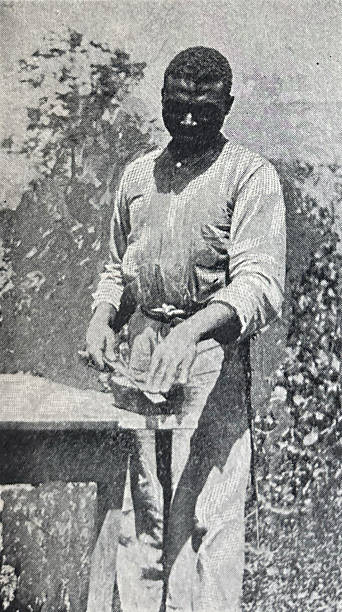istock Antique illustration - War with Spain - War of 1898 - man sharpening a machete 2219310287