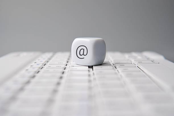 istock A cube with an at sign or at symbol on a laptop keyboard. 2219313036