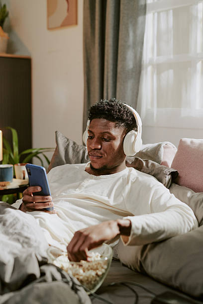 istock Listening to Music While Browsing Smartphone at Home 2219313492