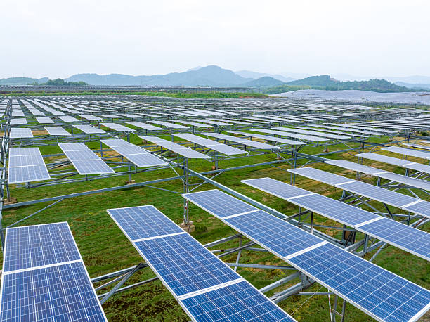 istock Solar panels fields on the green hills 2219316638