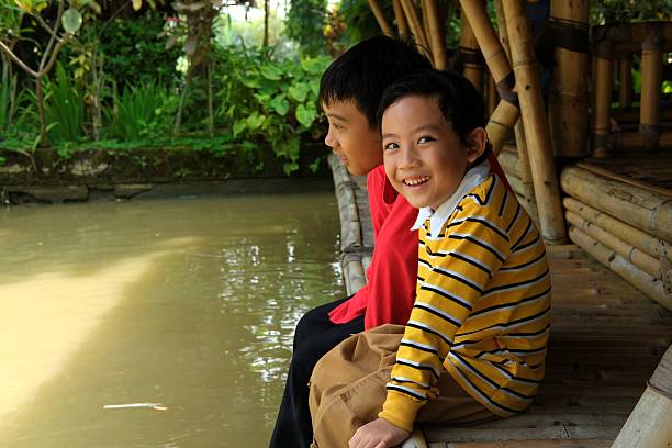 Cambodian school children standing in doorway of classroom in small village near Tonle Sap, Cambodia.