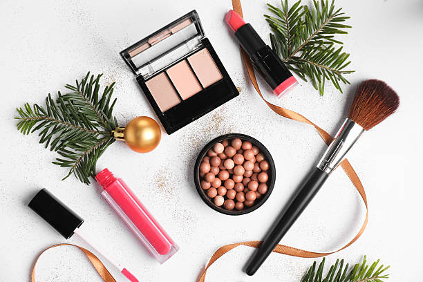 istock Flat lay composition with makeup products and Christmas decor on white background 2219321011