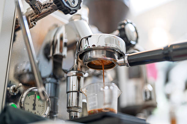 istock Close-Up of Espresso Extraction from Coffee Machine 2219322077