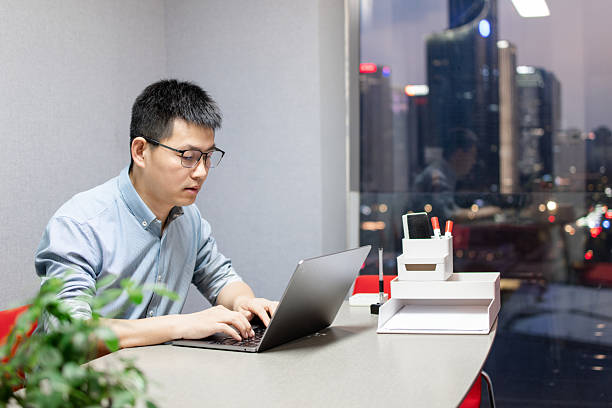istock The man is working overtime with laptop in the office at night 2219322465