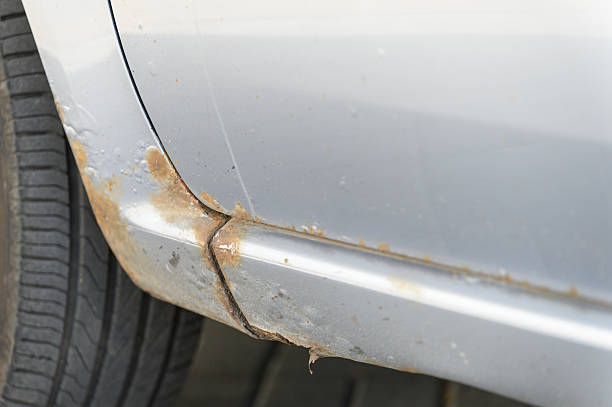 istock Close-up of rusty car sill with corrosion damage. 2219323353