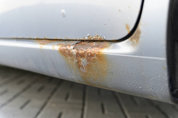 istock Close-up of rusty car sill with corrosion damage. 2219323391