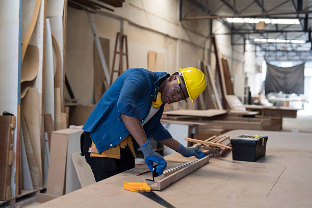 istock Black people, Carpenter and furniture workshop. African American male carpenter using tools for making furniture from wood in furniture factory. One male carpenter and small business in workshop 2219323398