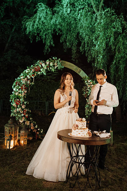 istock newlyweds happily cut and taste the wedding cake 2219324192