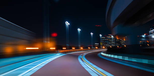 istock Curving Fast Toward the City Glow 2219326518
