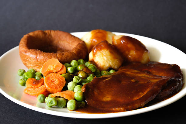 istock Roast Beef Vegetables and Yorkshire Pudding Traditional British Sunday Roast 2219327672