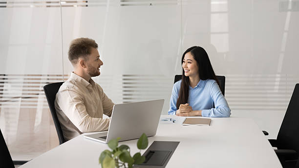 istock Formal meeting between professional man and woman in office 2219329476