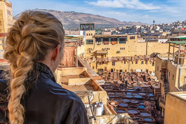 Chouara Tannery, Fez, Morocco: A woman seen from behind looking at the Chouara Tannery.