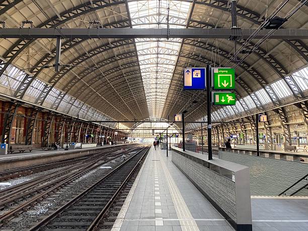 istock Modern train station interior with tracks and platforms. 2219331170