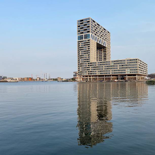istock Modern architecture reflecting on water in Amsterdam. 2219331173