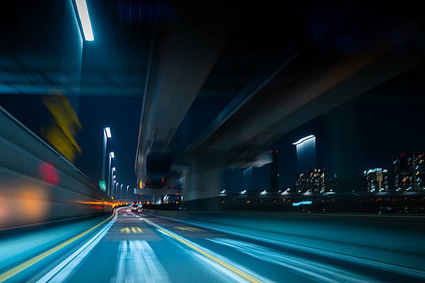 istock Speeding Under the Overpass with City Lights 2219331400
