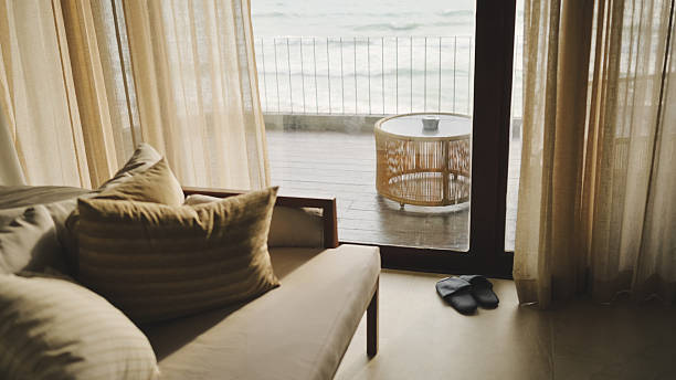 istock luxury beachfront hotel room with panoramic ocean view and cozy seating area relaxing coastal retreat with elegant decor and a stunning sea view 2219333442