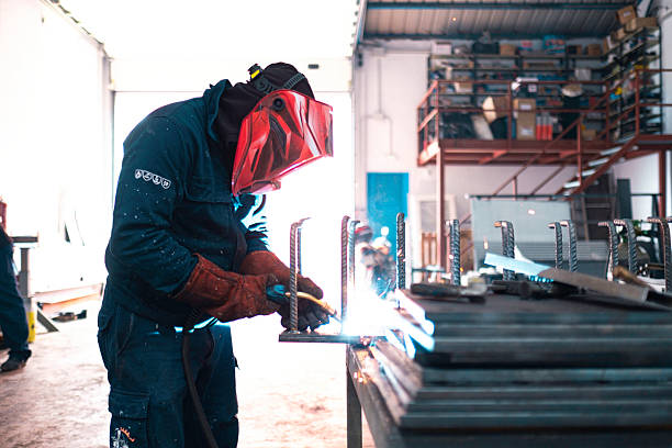 istock Skilled welder working in industrial workshop 2219333718